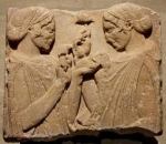 Persephone and Demeter holding mushrooms and food wallet, an implement of the Mysteries used to hide secret edible objects. From the Pharsalos bas-relief (5th c BCE), now in the Louvre.